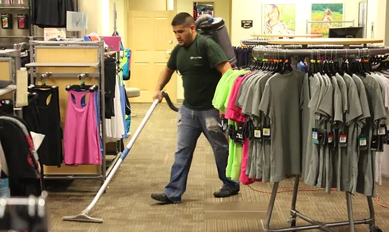 man cleaning a carpet