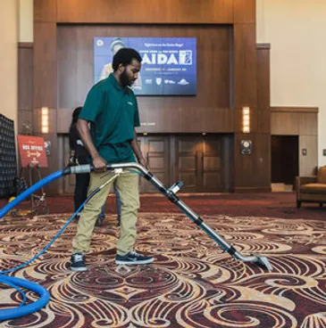 man cleaning a carpet